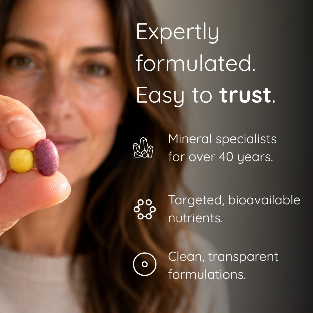 Woman holding two multivitamin pills with text about expertly formulated products.