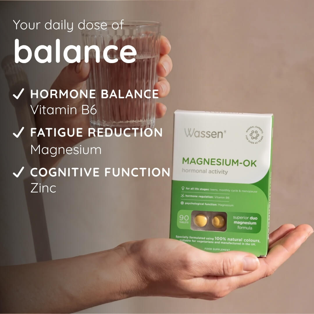 A hand holds a box of Wassen Magnesium-Ok alongside a glass of liquid, with promotional text on the left highlighting benefits for hormone balance, fatigue reduction, cognitive function, and zinc support.