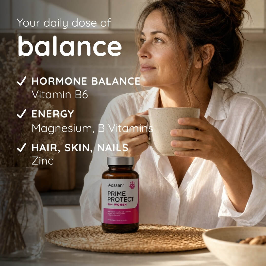 A woman in a white blouse holds a mug at a table while a bottle of Uscante Prime Protect for Women sits in front of her. Text on the left lists benefits: hormone balance, energy, hair/skin/nails, and vitamin B6, magnesium, and zinc.
