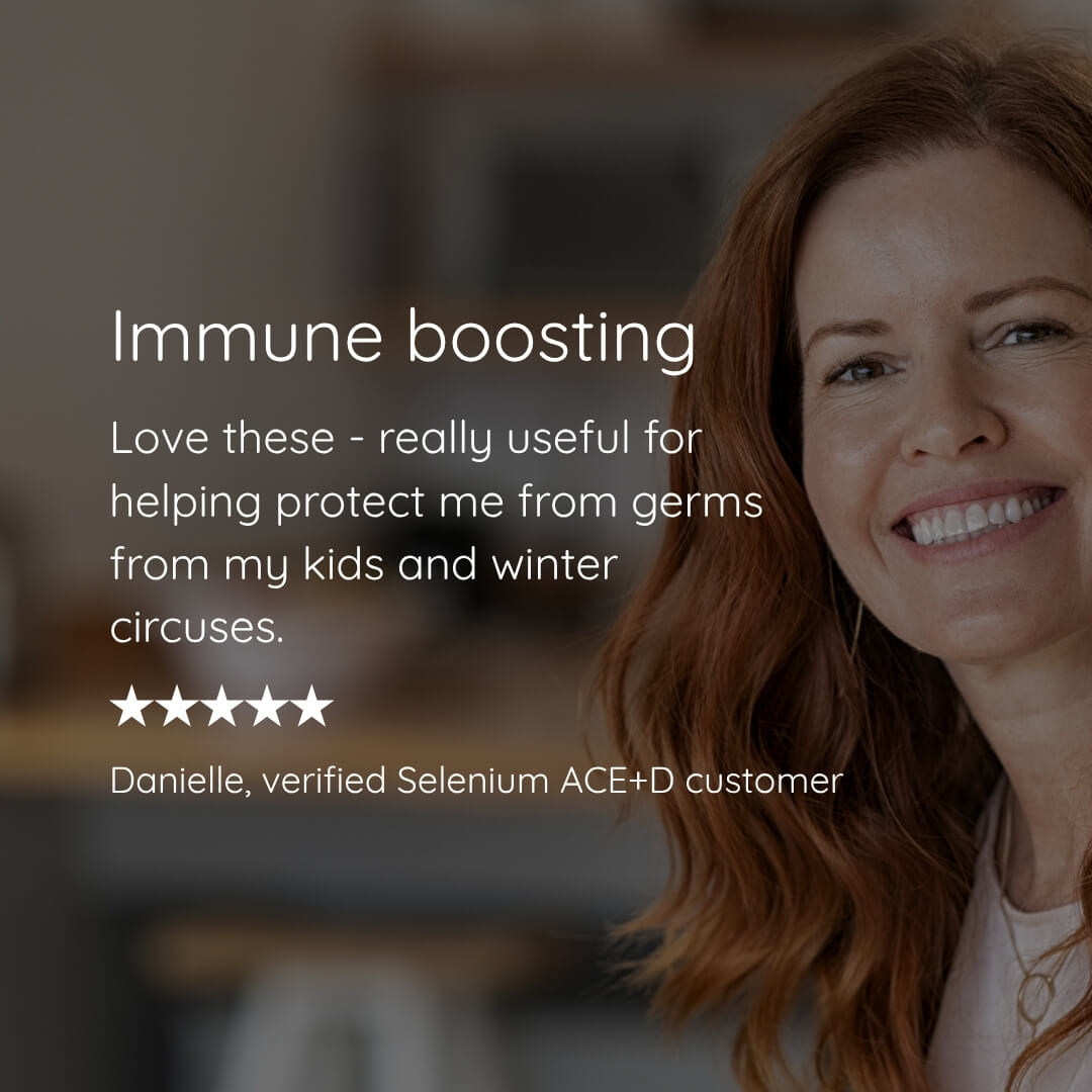 A smiling woman with red hair appears on the right side of a dark promotional graphic with text reading 'Immune boosting' and a customer review from Danielle, verified Selenium ACE+D customer.