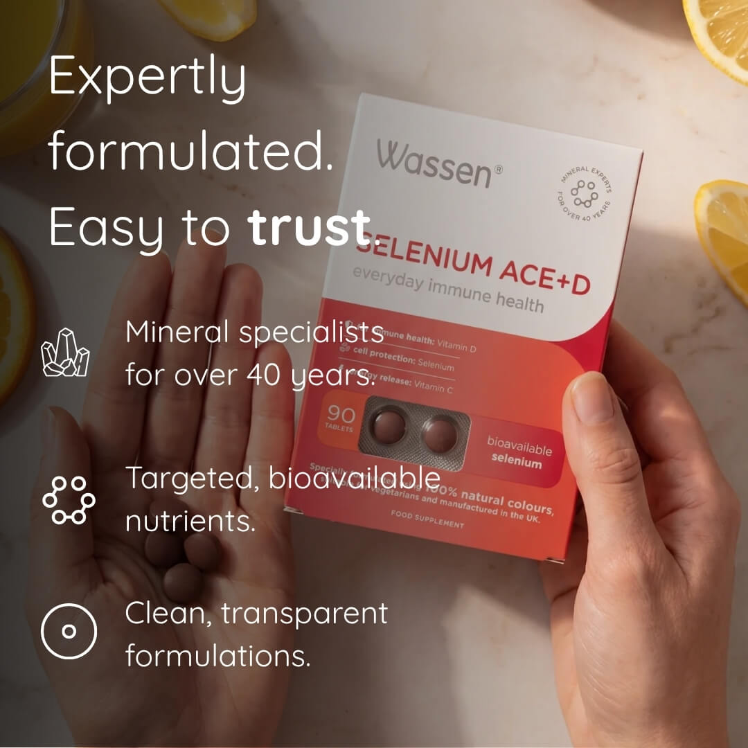 A person holds a box of Wassen Selenium Ace+D dietary supplement over their hands, with lemon slices in the background and marketing text on the left.
