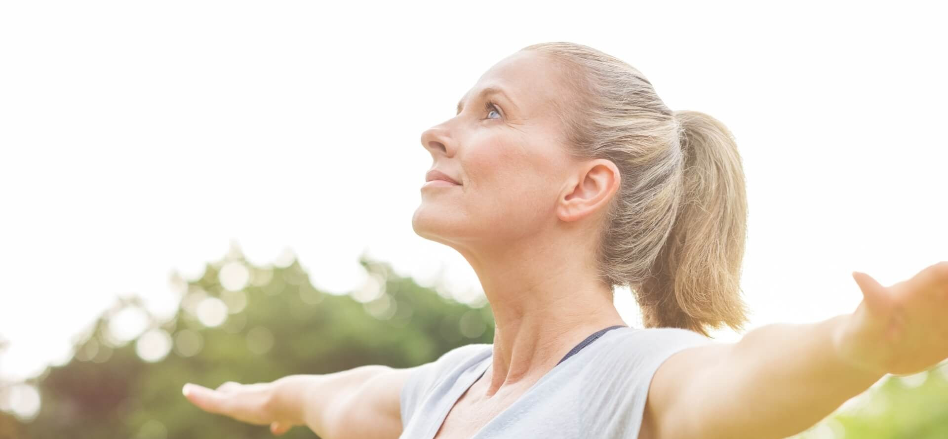 Wassen woman doing yoga outside in nature