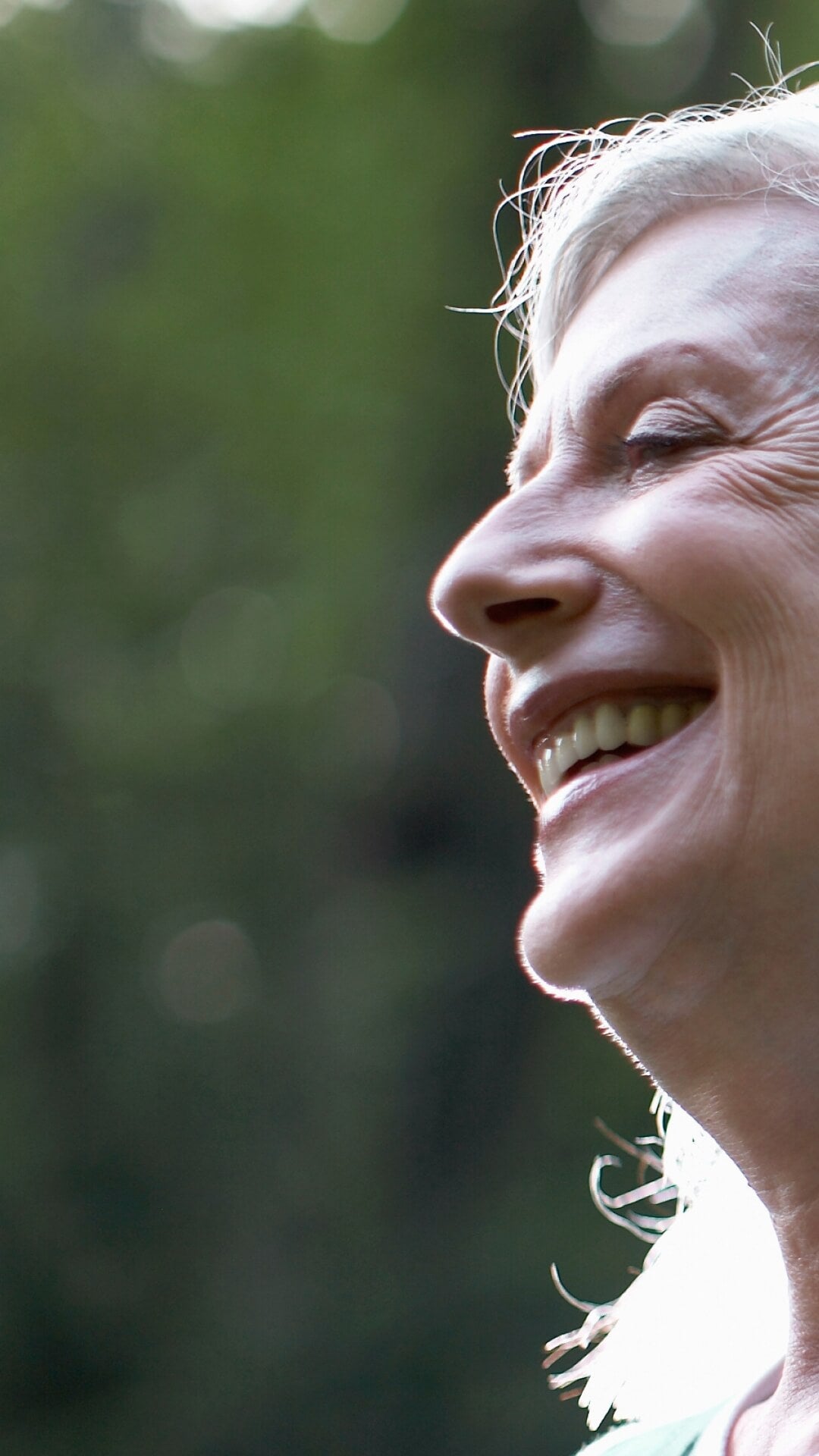 happy woman outside smiling in nature